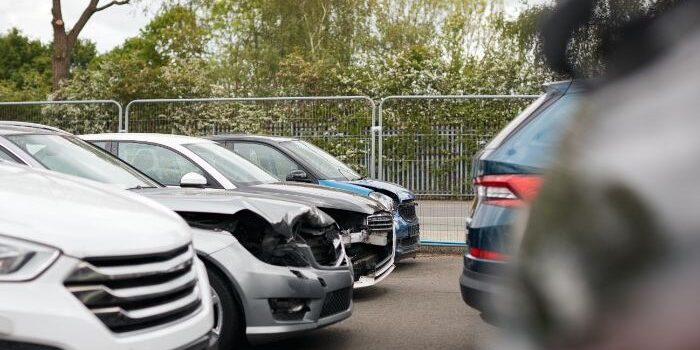 cars-damaged-in-motor-vehicle-accidents-parked-in-Z6VGE73-1