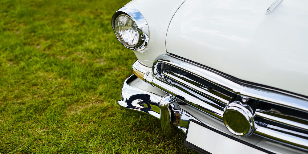 Retro car parked on grass